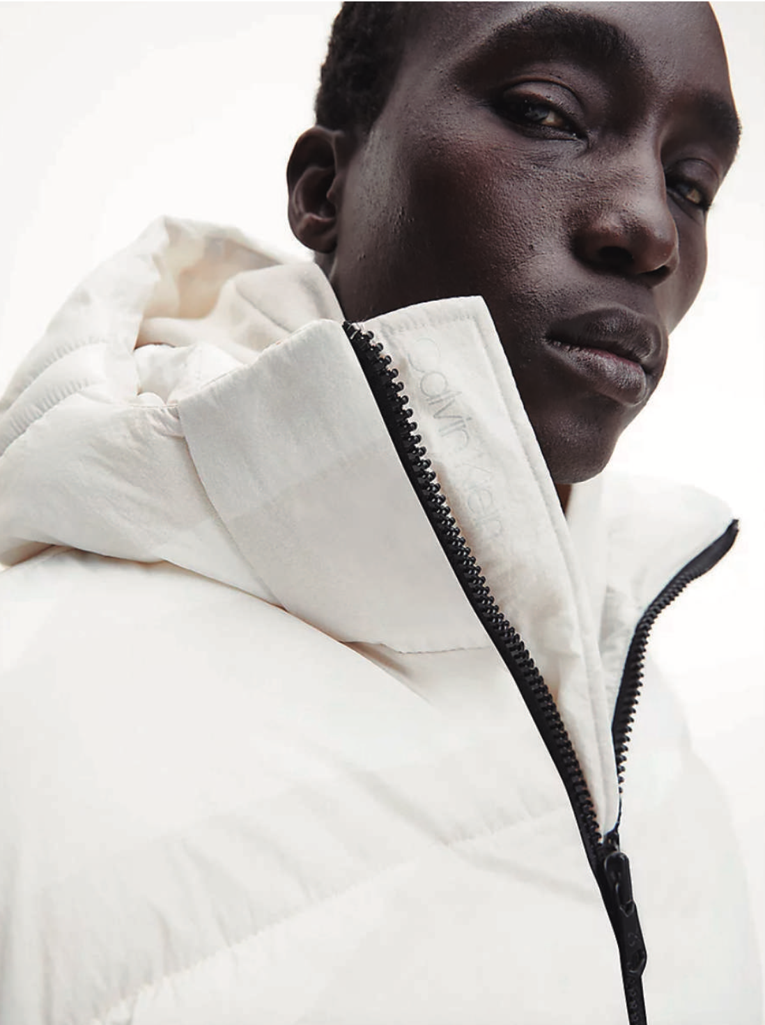 Calvin Klein — white puffer, portrait detail